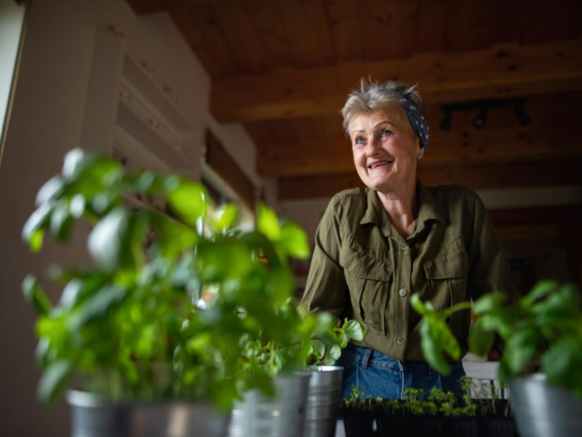 Senior woman and potted plants